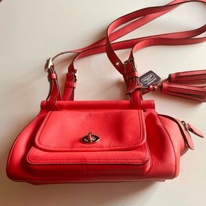Coach mini crossbody bag in orange leather